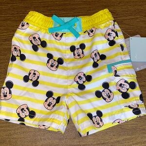 NWT Disney swim trunks size 9-12M